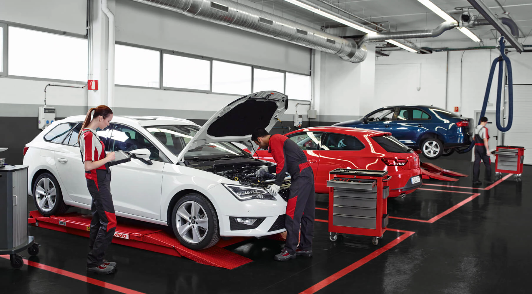 Professional automotive technician working on car diagnostics